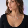 AOI model wearing the celestial key and moon layered necklace