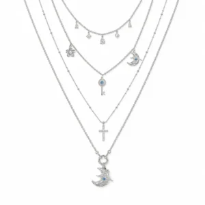aoi-celestial-key-moon-layered-necklace-hero-white-background AOI celestial key and moon layered necklace on a clean white background