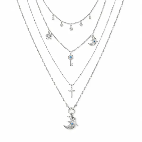 AOI celestial key and moon layered necklace on a clean white background