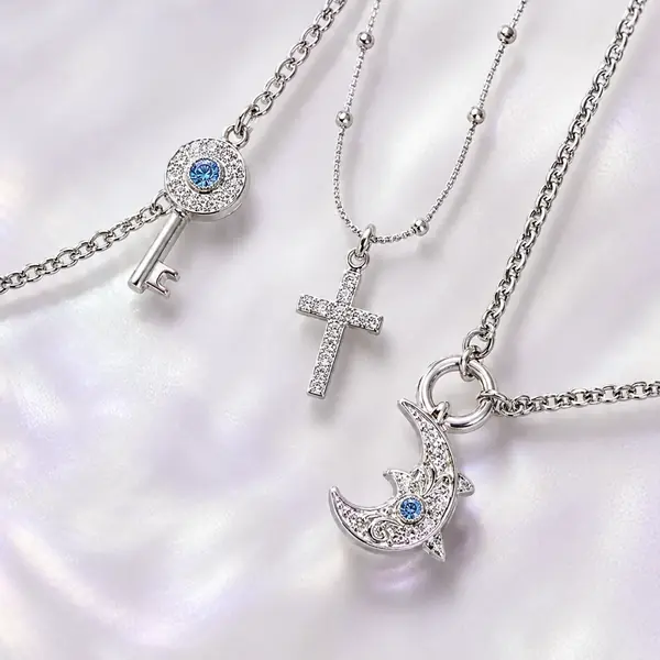 Macro detail of celestial, key and moon charms