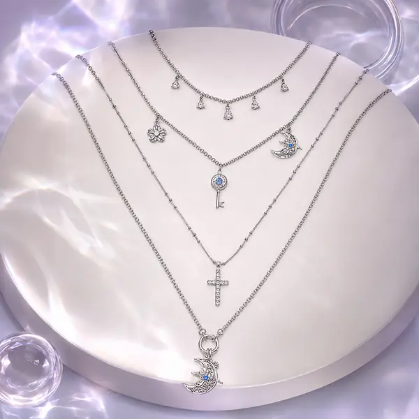 AOI celestial layered necklace in a MIRLINKS Y3K editorial