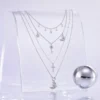 AOI celestial layered necklace in a silver chrome Y3K editorial