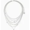 AOI silver multi-layer music and infinity necklace on a white background