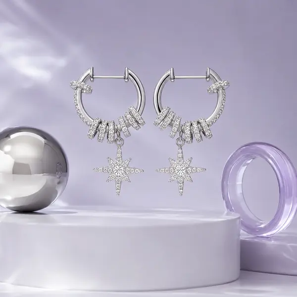 Celestial Starburst Hoop Earrings | Silver-Tone Pavé Drop Earrings in a MIRLINKS Gen Z Y3K jewelry editorial