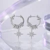 Celestial Starburst Hoop Earrings | Silver-Tone Pavé Drop Earrings in a silver chrome Y3K editorial setting