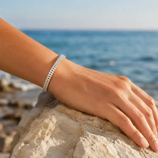 RHEA double-row bracelet in a natural coastal jewelry editorial