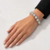 Scale and fit view of the 12mm RHEA cushion halo bracelet